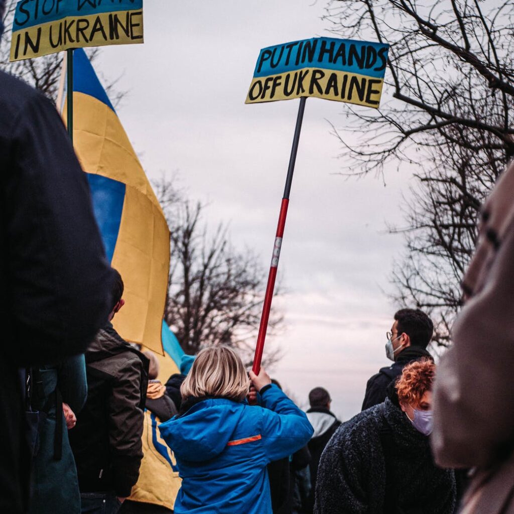 back view of a young girl protesting against war