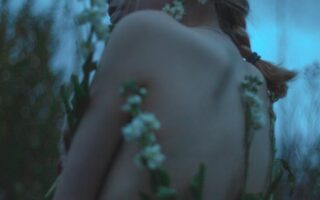 woman surrounded by flowers