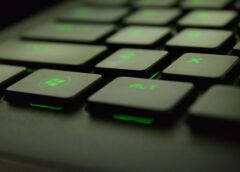 close up photography of black and green computer keyboard keys