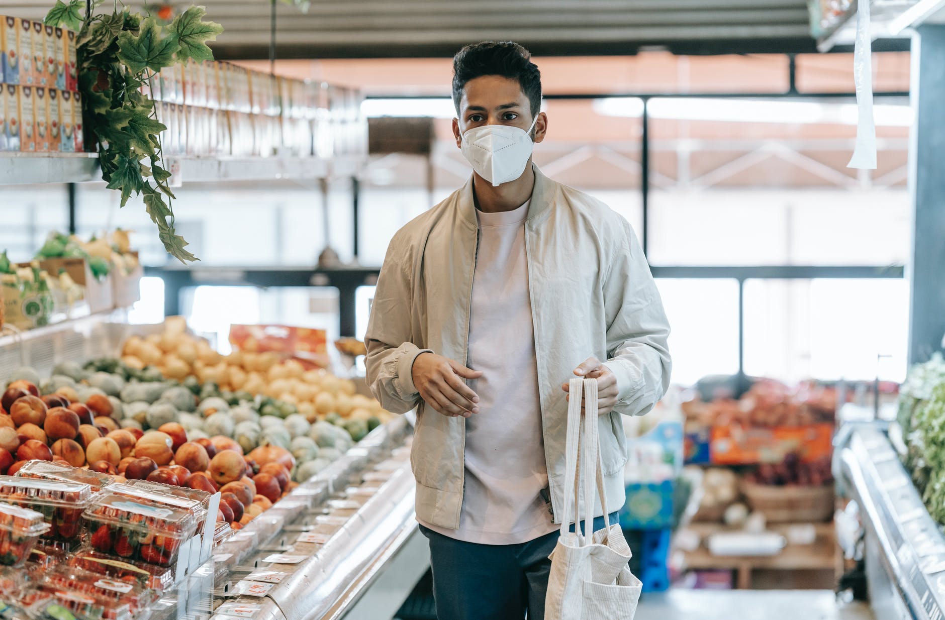 customer with eco friendly bag in supermarket