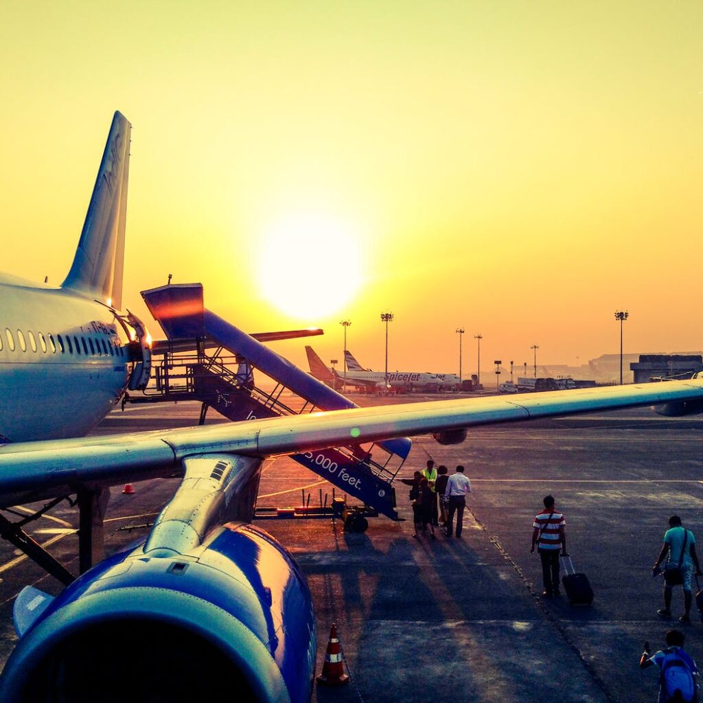photography of airplane during sunrise