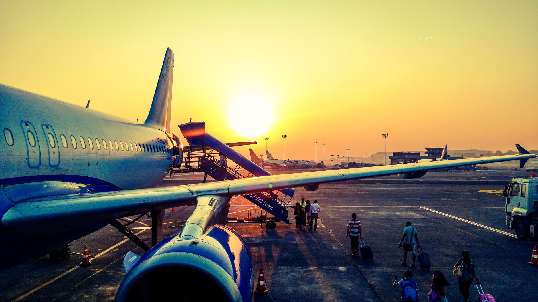 photography of airplane during sunrise