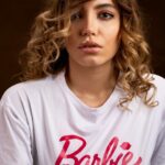 beautiful woman wearing a white shirt posing