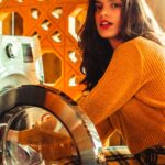 woman wearing orange sweater
