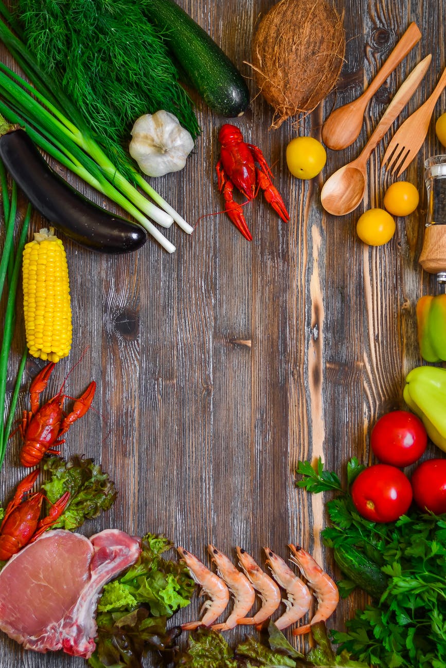 vegetables and tomatoes on cutting board