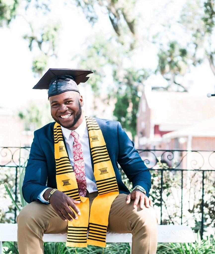photo of man wearing graduation cap