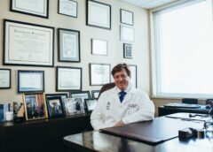 doctor sitting in front of his desk
