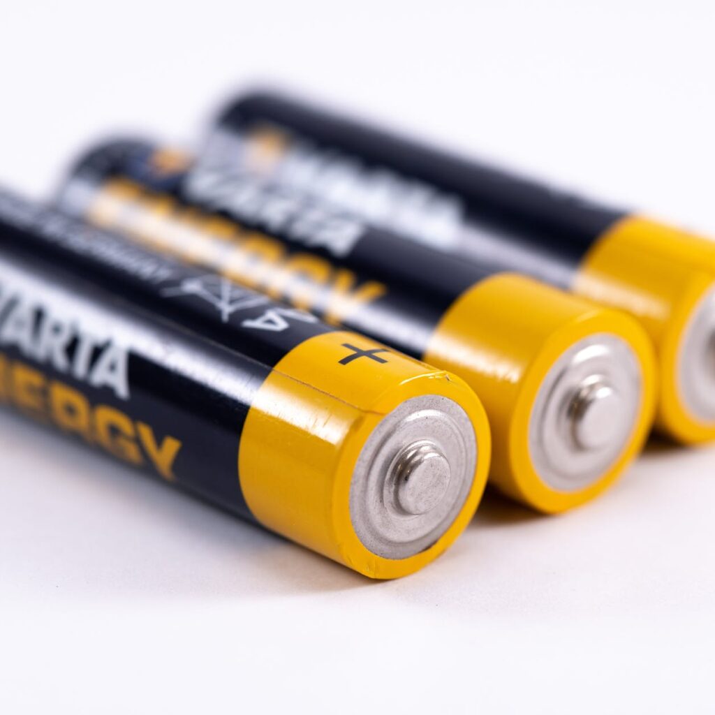 close up shot of black and yellow batteries