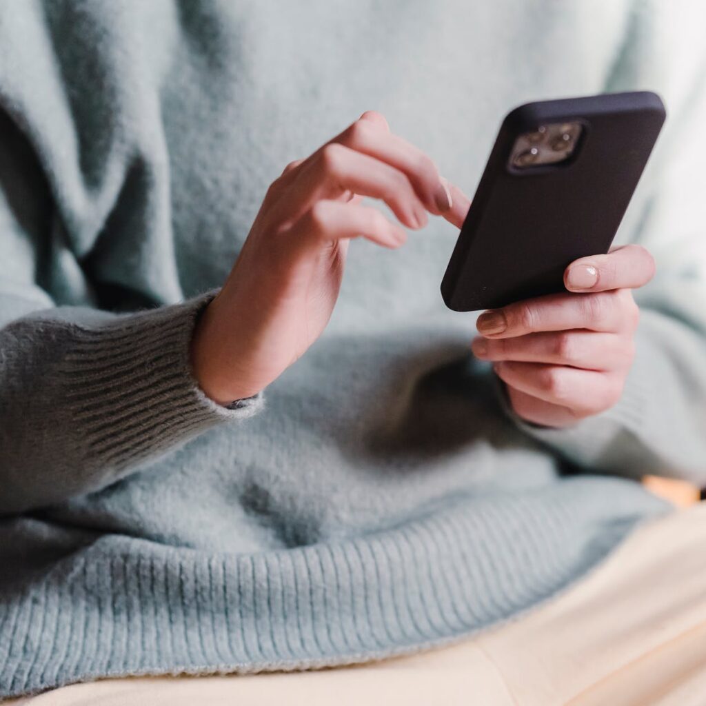 woman surfing internet with mobile phone