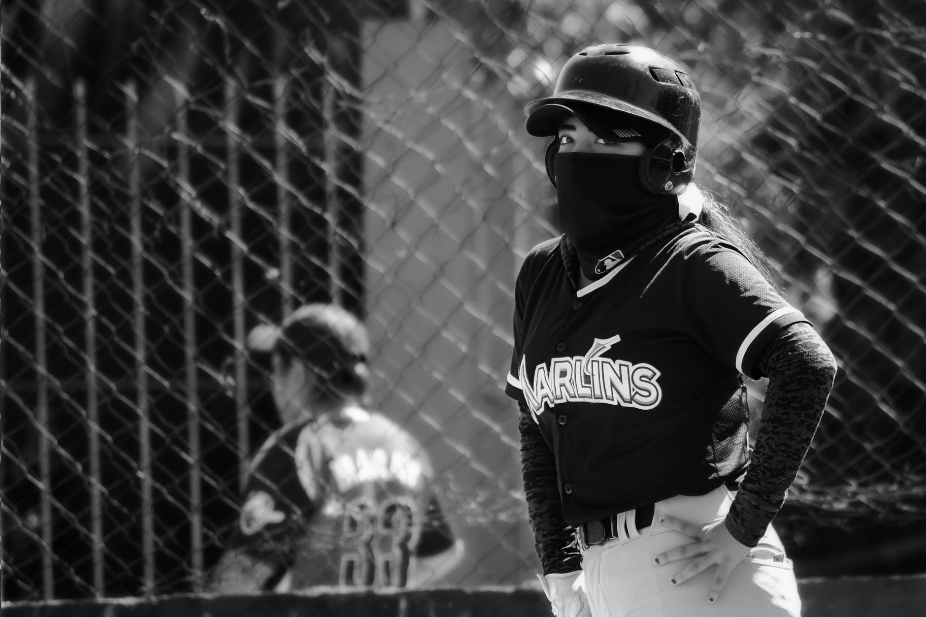 person wearing a uniform playing baseball