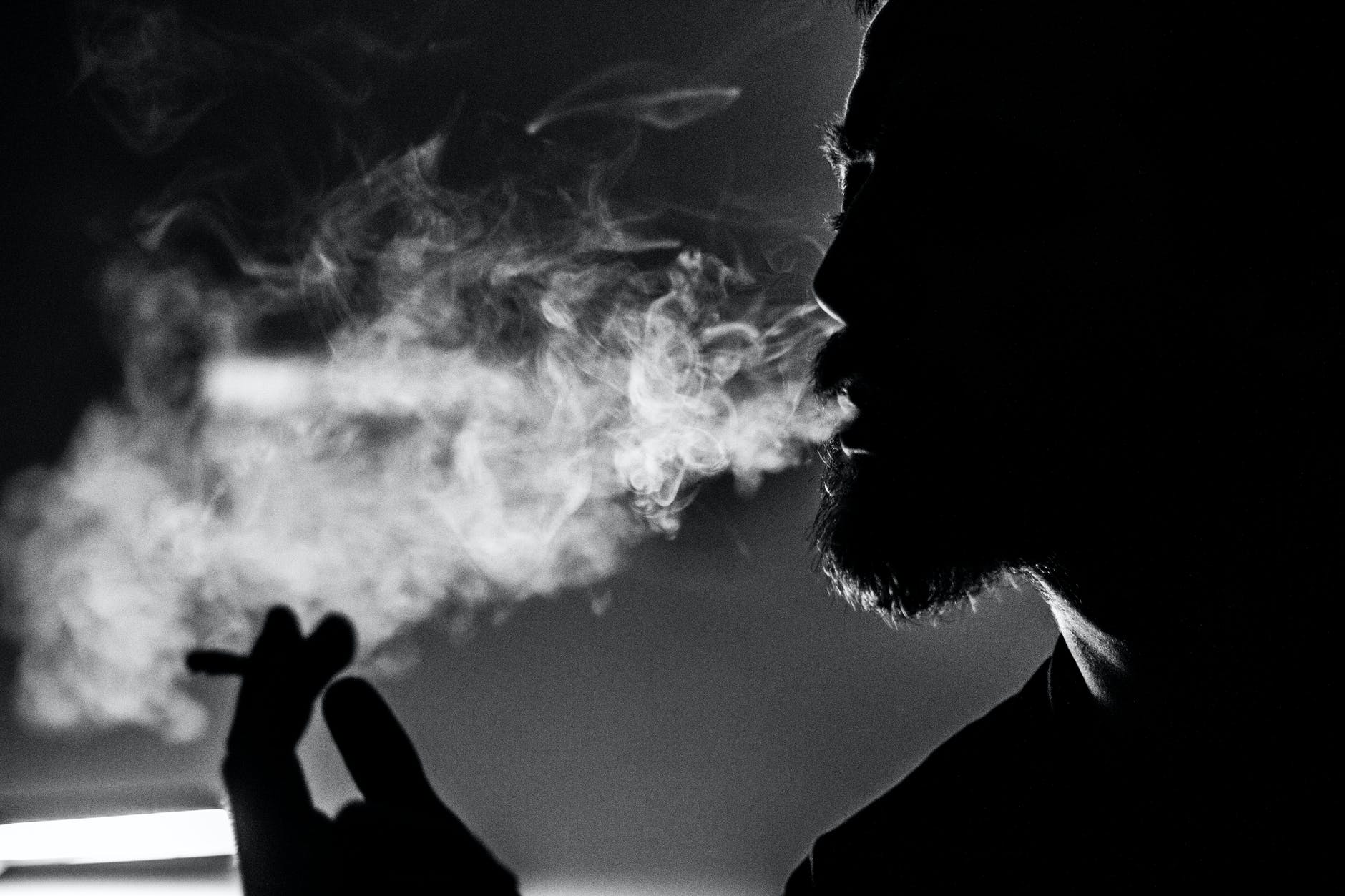 man holding cigarette