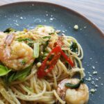 shrimp pasta served on gray plate