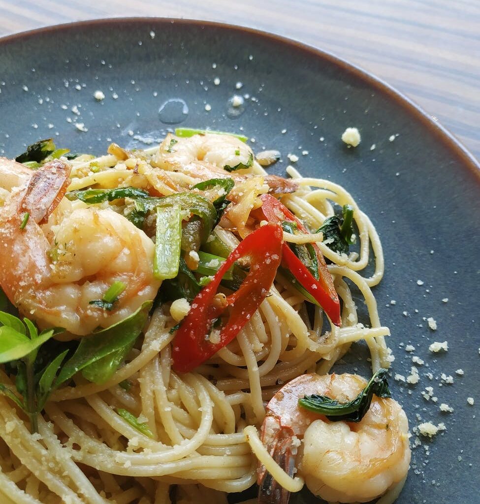 shrimp pasta served on gray plate