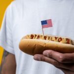 person holding hotdog