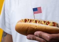 person holding hotdog
