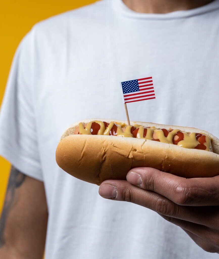 person holding hotdog