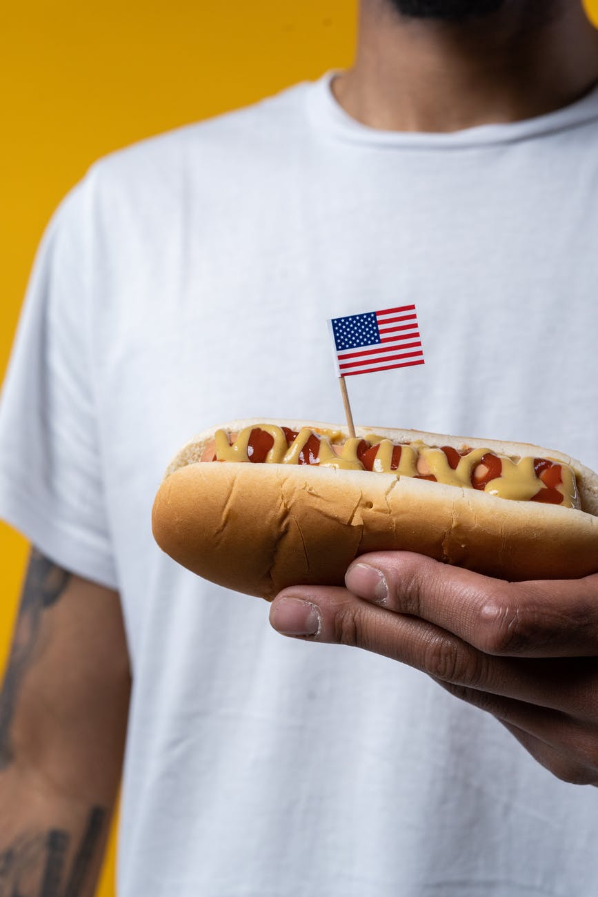 person holding hotdog