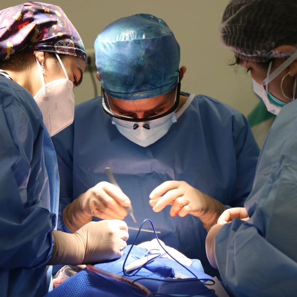 medical people performing a surgery