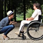 woman on black folding wheelchair