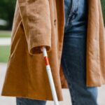 person holding a white cane