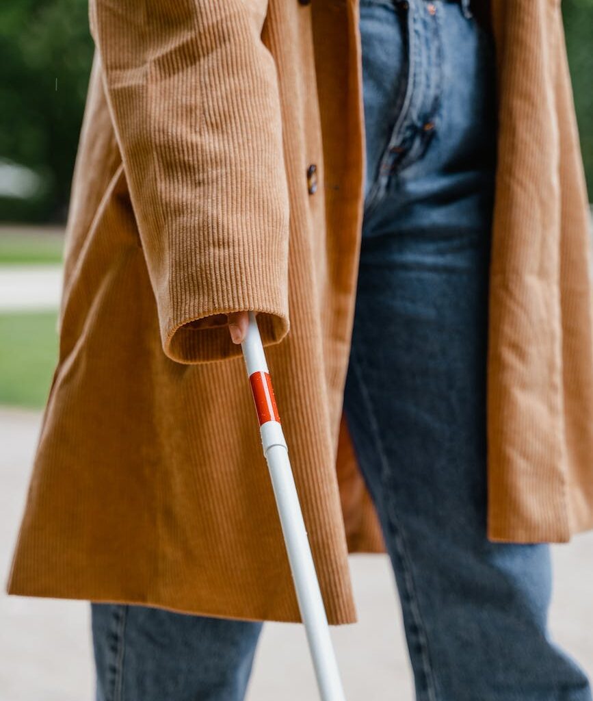 person holding a white cane