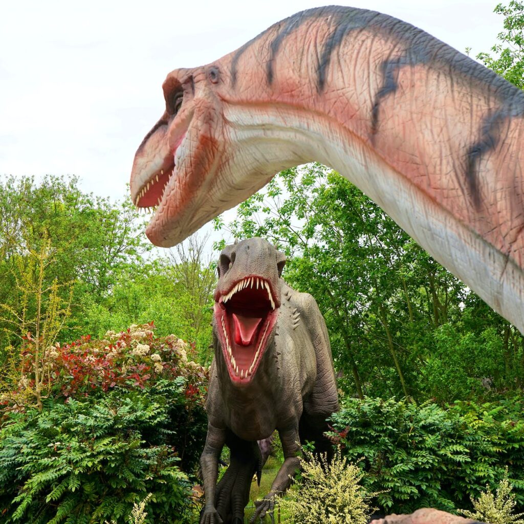 two dinosaur statues